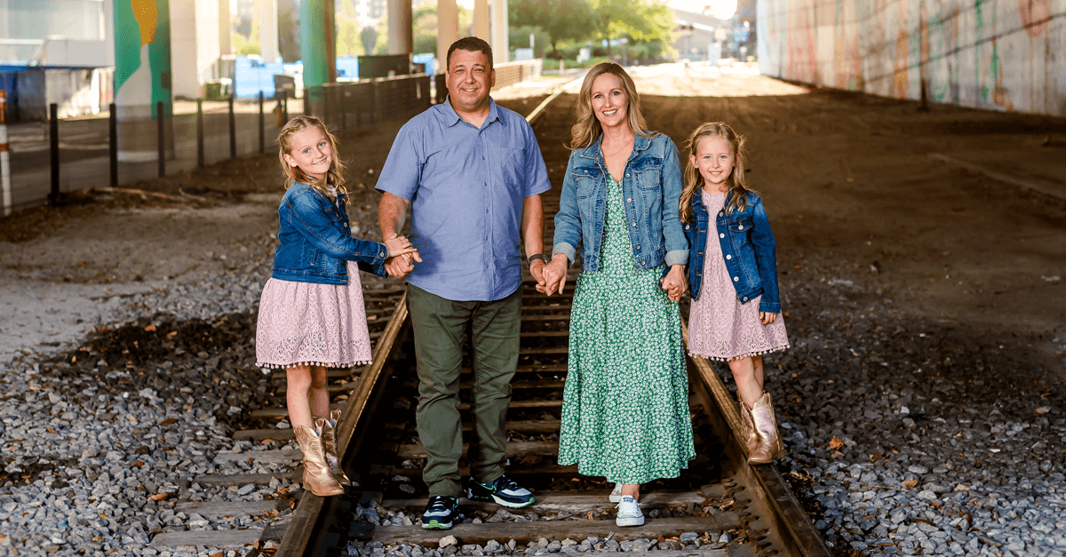 The Johnson Family walking over train tracks representing the hope and healing of chosen's services.