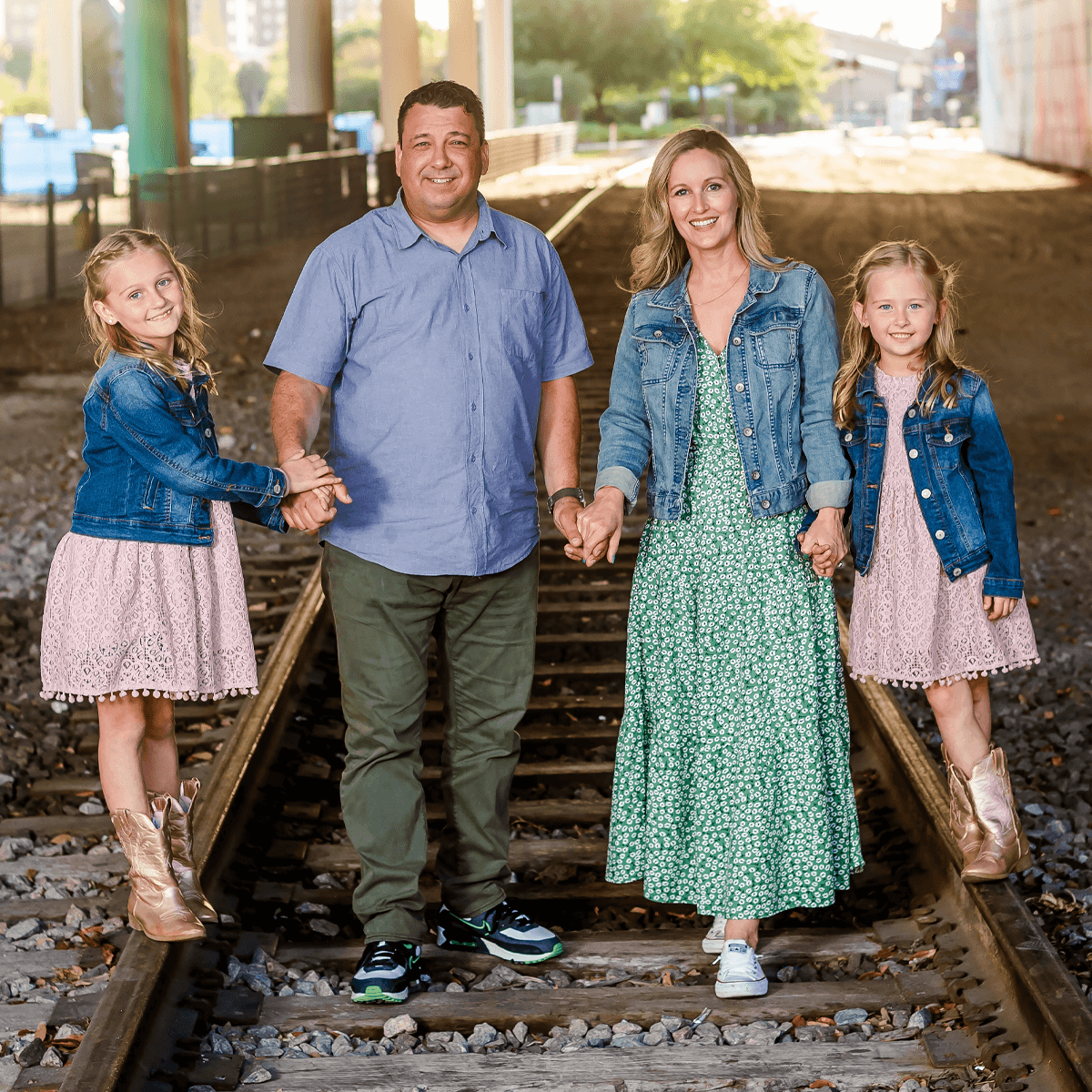 The Johnson Family is walking around outside down the railroad tracks representing the journey of healing they are on.