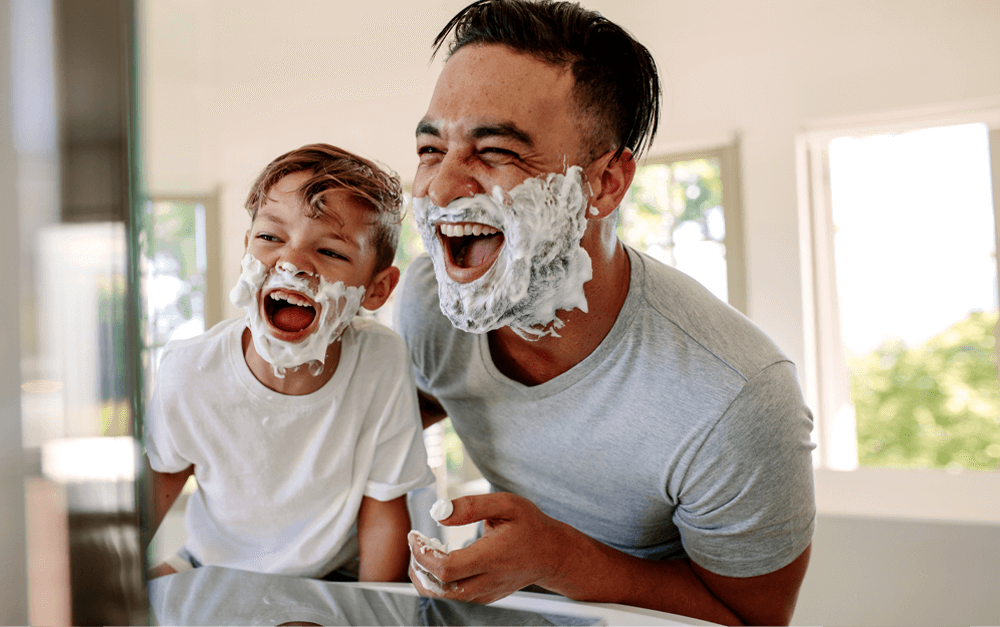 Chosen father teaching son how to shave represents the tools he learned by applying chosen services in his parenting.